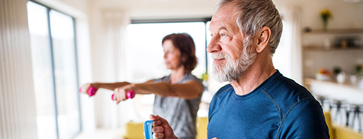 Image of older man and his wife doing cardio exercises